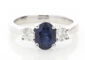 18ct White Gold Three Stone Oval Centre Diamond And Sapphire Ring 0.50 Carats